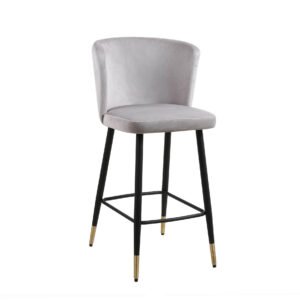 A modern bar stool with a light gray cushioned seat and backrest. It has sleek black legs with gold tips, providing an elegant and contemporary look.