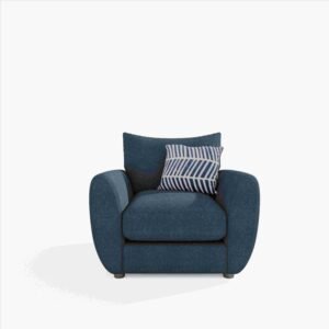 Blue fabric armchair with rounded arms and a striped, geometric-patterned pillow. The chair exudes a cozy, inviting feel against a plain white background.