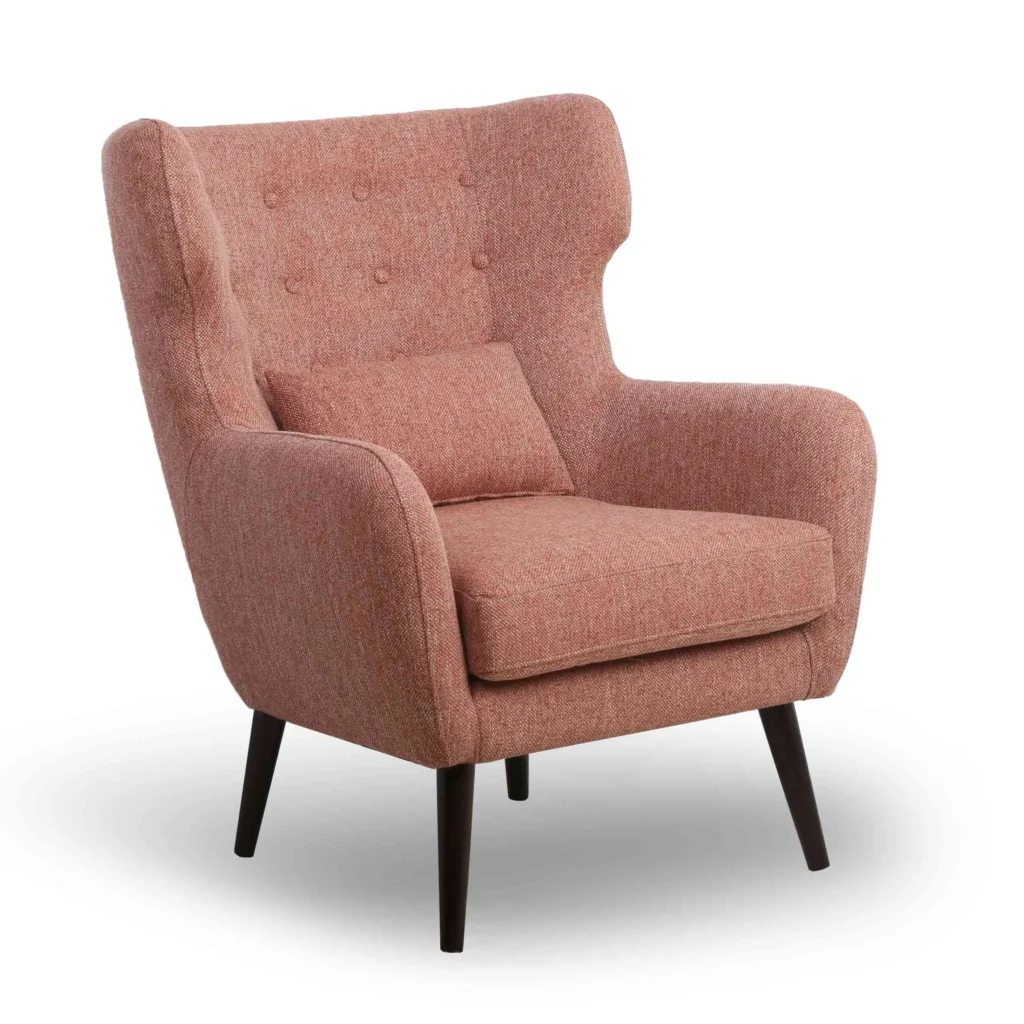 A mid-century modern pink armchair with a high back, tufted upholstery, and dark wooden legs. The chair exudes a cozy and stylish aesthetic.