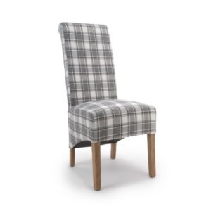 A chair with a tall backrest, upholstered in gray and white plaid fabric, features light wooden legs. The style is modern and minimalist.